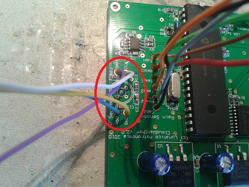 PCB with the old sensor's solder points circled in red