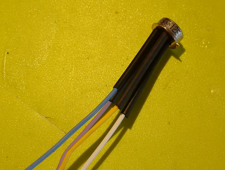The new sensor soldered to the wires, with heat shrink tubing applied