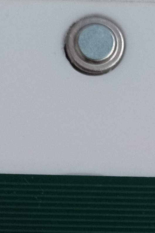 The IR sensor covered with a small round sticker