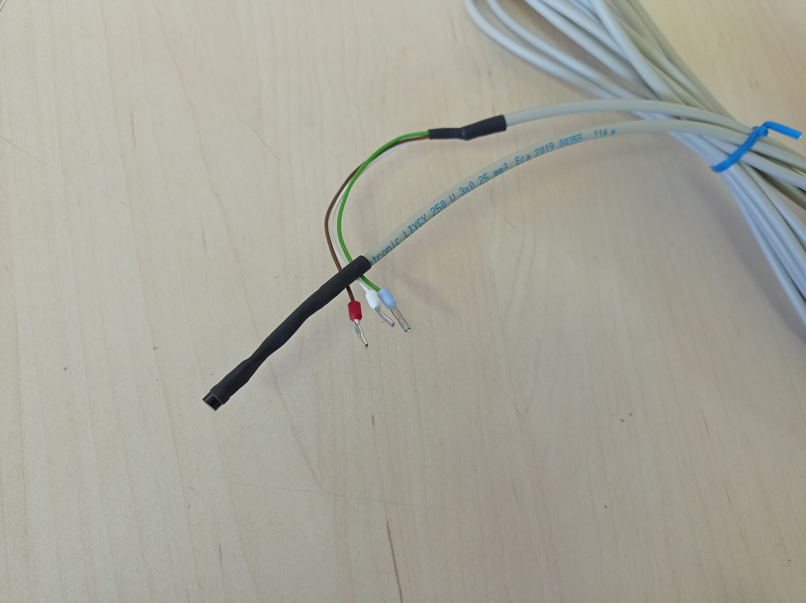 The temperature sensor's 3-wire cable, heat-shrink tubed, ready to connect