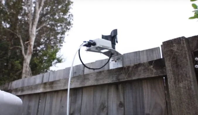 A CloudWatcher with anemometer mounted on a garden fence