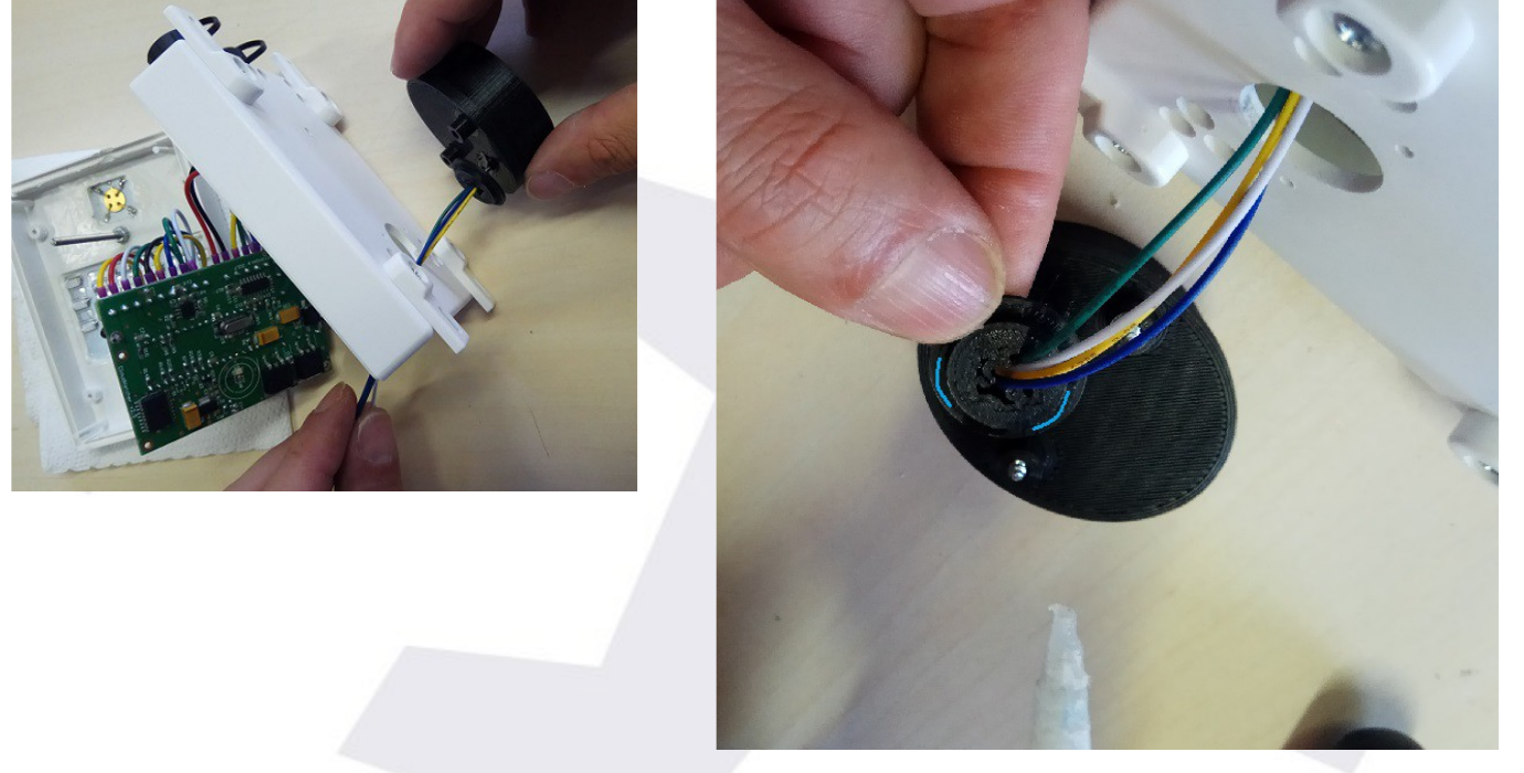 The round sensor piece being placed into the box hole, and glue being applied